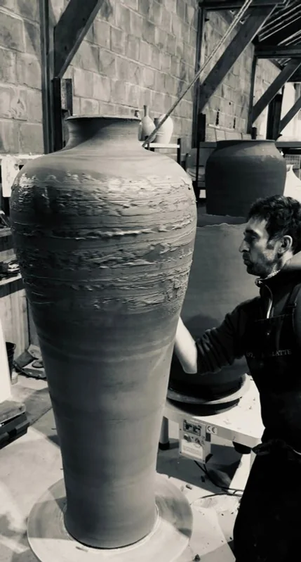 Hand-shaping gesture on clay