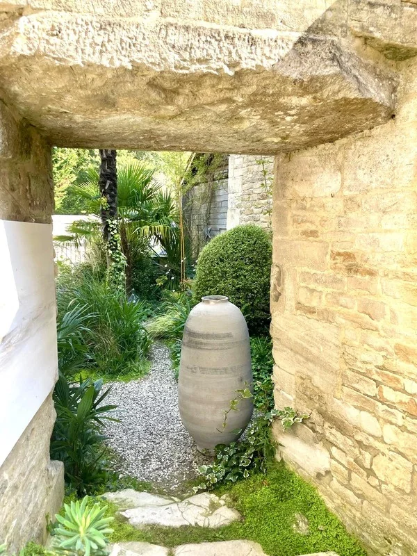 White OLIVIO in a stone passage